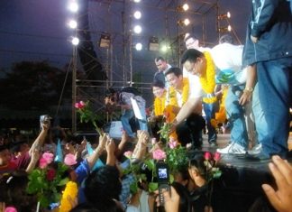 Prime Minister Abhisit Vejjajiva takes to the stage in front of the Banglamung District Office in the lead up to national elections.